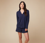 Full-length view of model Anna wearing the Pima PJ Longsleeve and Pima PJ Shorts in Navy, showing off the relaxed, comfortable style of the set.