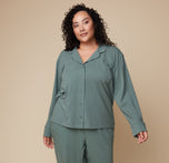 Model Bianca in the Pima PJ Longsleeve and Pima PJ Pants in Rainforest, standing with a relaxed posture. The buttoned-up look highlights the cozy, comfortable fit.