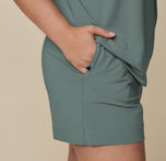 Close-up of model Summerlyn wearing Pima PJ Shorts in Rainforest (Size: L). The image focuses on the side pocket detail, highlighting the soft, comfortable fabric and relaxed fit of the shorts.