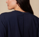 Close-up of the back of the Pima Tee in Navy worn by model Anna, focusing on the neckline and seam detail.