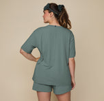 Back view of model Summerlyn in the Pima Tee in Rainforest, paired with Pima PJ Shorts, showcasing the relaxed, loose fit and soft fabric from behind.