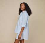 Woman wears Classic Poplin Pajama Shirt in color Ice Blue
