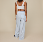 Woman wears the Classic Poplin Pajama Pant in color Ice Blue