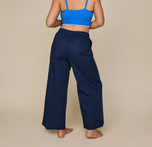 Woman wears the Classic Poplin Pajama Pants in color Midnight