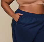 Woman wears the Classic Poplin Pajama Pants in color Midnight
