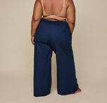 Woman wears the Classic Poplin Pajama Pants in color Midnight