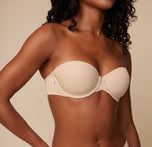 Close-up shot of Ally’s upper body in the Base Strapless Bra in Beige, focusing on the smooth cups and supportive band.