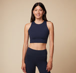 Anna wearing the Flex Tank and Flex High Rise Leggings in Ink. The tank features a high neckline and cropped fit, while the leggings offer a high-waisted design for support, front view. sizing: Anna wears size Small