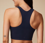 Close-up back view of Anna in the Flex Tank focusing on the racerback design.