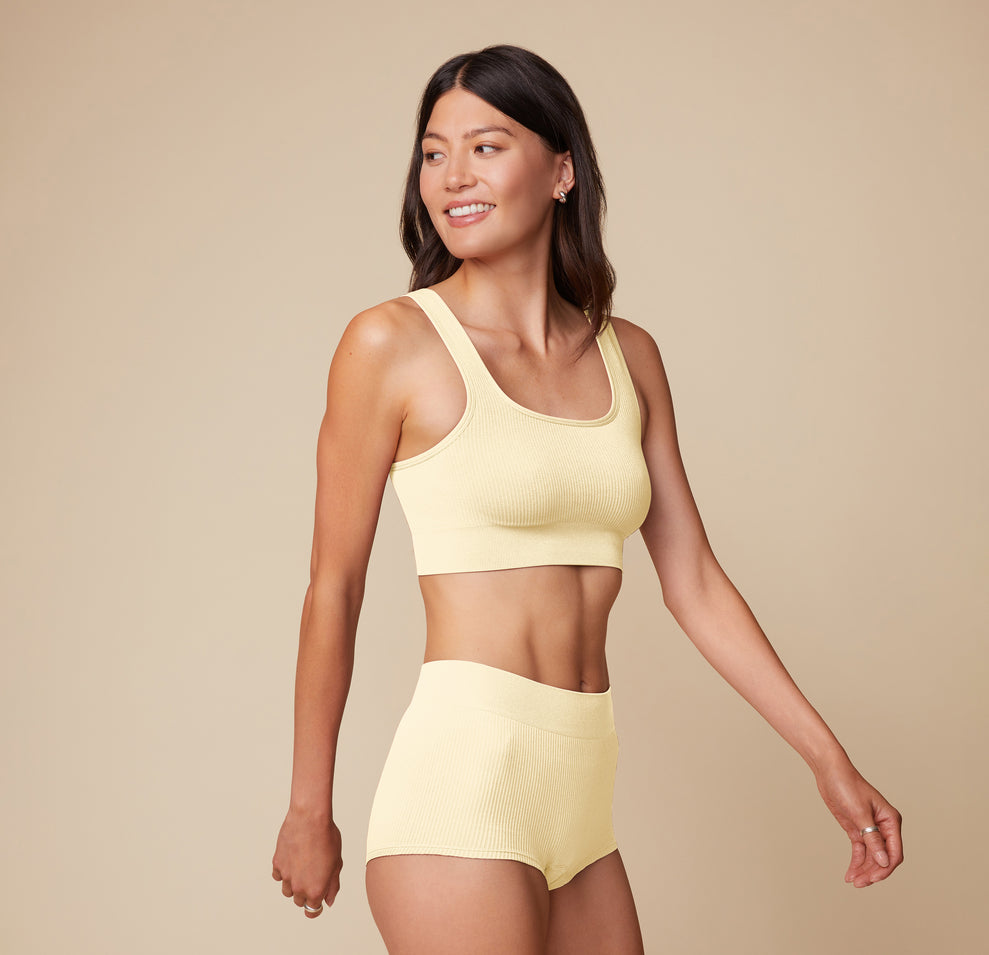 Front view of model Anna wearing the Lounge Scoop Bralette and Lounge Rib Boyshort in Sunnyside, emphasizing the comfy fit and soft fabric texture. sizing: Anna wears size Small
