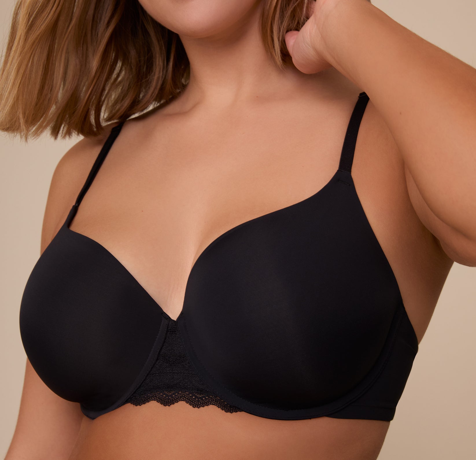 Close-up of Sonnie in the Base Lace T-Shirt Bra in Black. The image features the contoured shape of the cups and intricate lace details, designed for everyday lift and comfort.