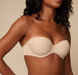 Close-up shot of Ally’s upper body in the Base Strapless Bra in Beige, focusing on the smooth cups and supportive band.