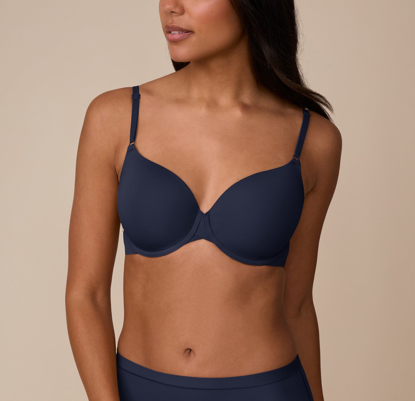 Close-up front view of Nemesis wearing the Base T-Shirt Bra in True Blue. The lightly lined cups offer full coverage and support, with front adjustable straps for a custom fit. sizing: Nemesis wears size 32DD