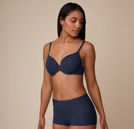 Three quarter angle of Nemesis in the Base T-Shirt Bra and matching Bliss Boyshort in True Blue, highlighting the bra’s lightweight, full-coverage shape and silky-soft microfiber fabric.