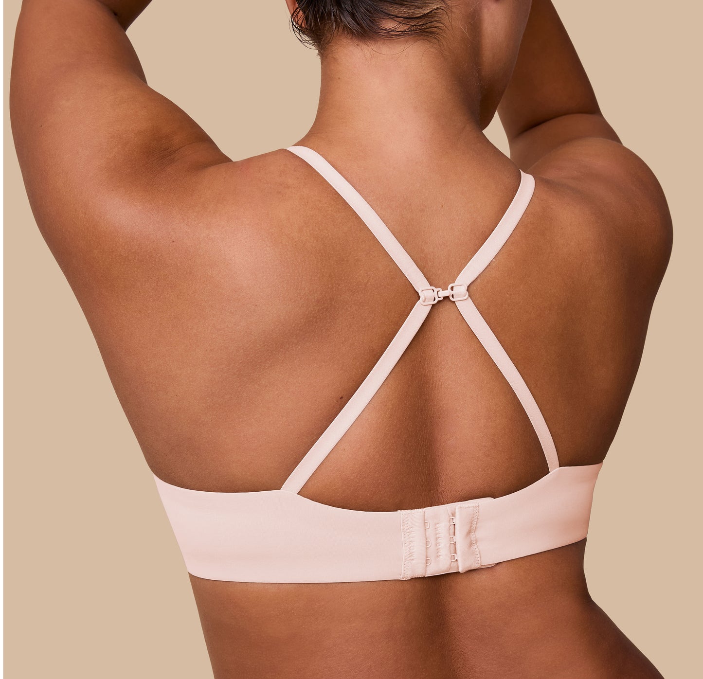 India showcases the Base T-Shirt Bra in Rose with the straps converted into a racerback style, demonstrating its versatile design.