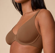 Close-up side view of Ally wearing the Base Unlined Bra in Brown, focusing on the unlined cup design and soft microfiber fabric.