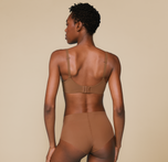 Woman wearing the Base Unlined Bra in the color Brown