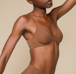 Woman wearing the Base Unlined Bra in the color Brown