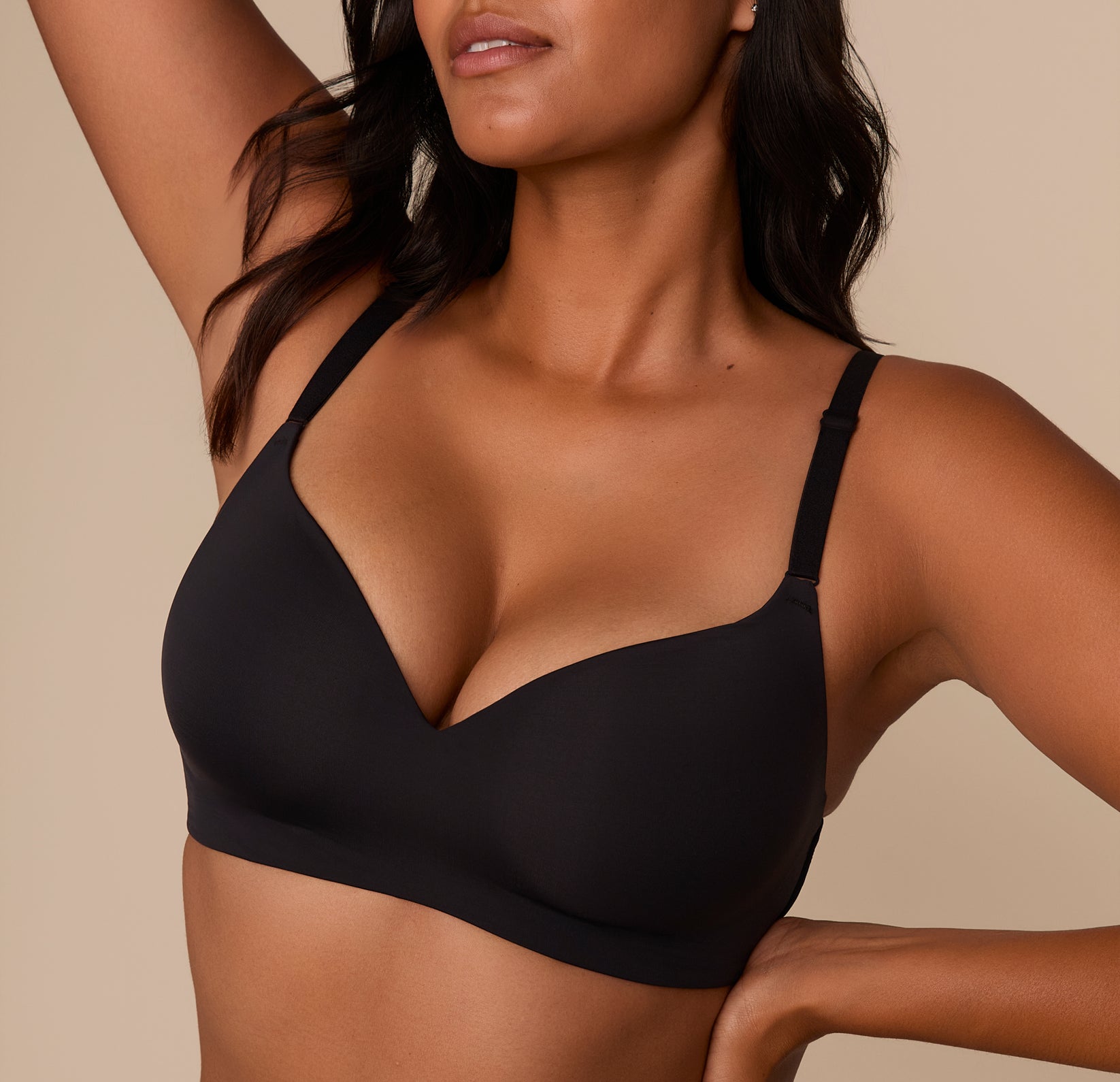 Close-up of Victoria in the Base Wirefree T-Shirt Bra in Black, showcasing the soft, lightly lined cups and V-neckline for a natural shape without wires.