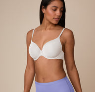 Three-quarter front angle of Nemesis highlighting the lightly lined cups and front adjusting straps of the Base T-Shirt Bra in Frost.