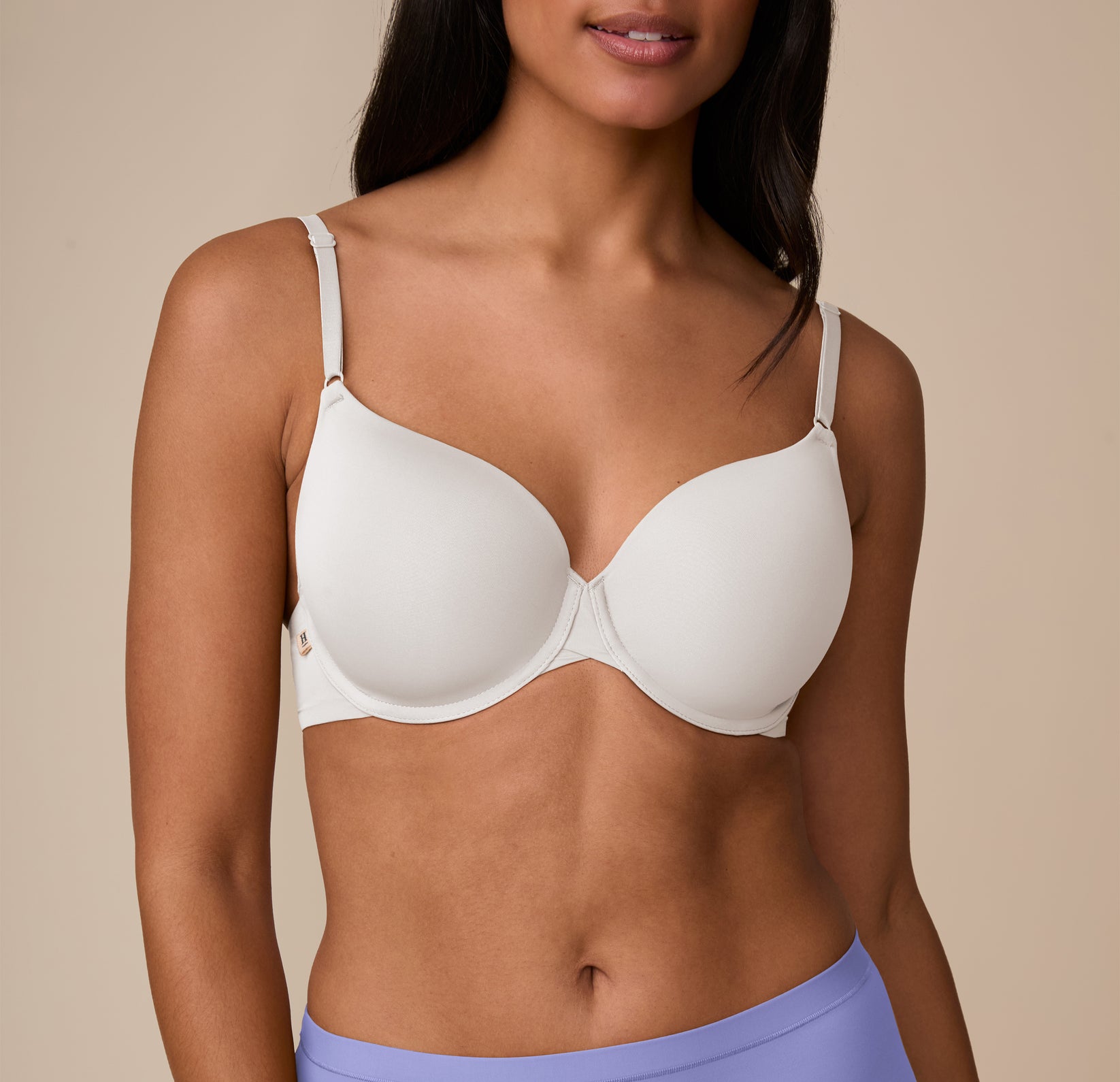 Close-up front detail of the Base T-Shirt Bra’s lightly lined cups, worn by Nemesis.