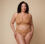 Bianca in the Bliss Plunge Adjustable Bralette and Bliss Thong, standing forward with a relaxed stance. sizing: Bianca wears size XL