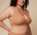 Close-up side view of Bianca wearing the Bliss Plunge Adjustable Bralette, highlighting the deep V neckline.