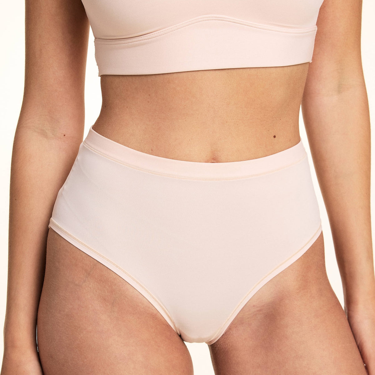 Close-up front view of Bliss Highwaist Brief in Rose showing high waistband and smooth front panel, paired with Bliss Bralette in Rose