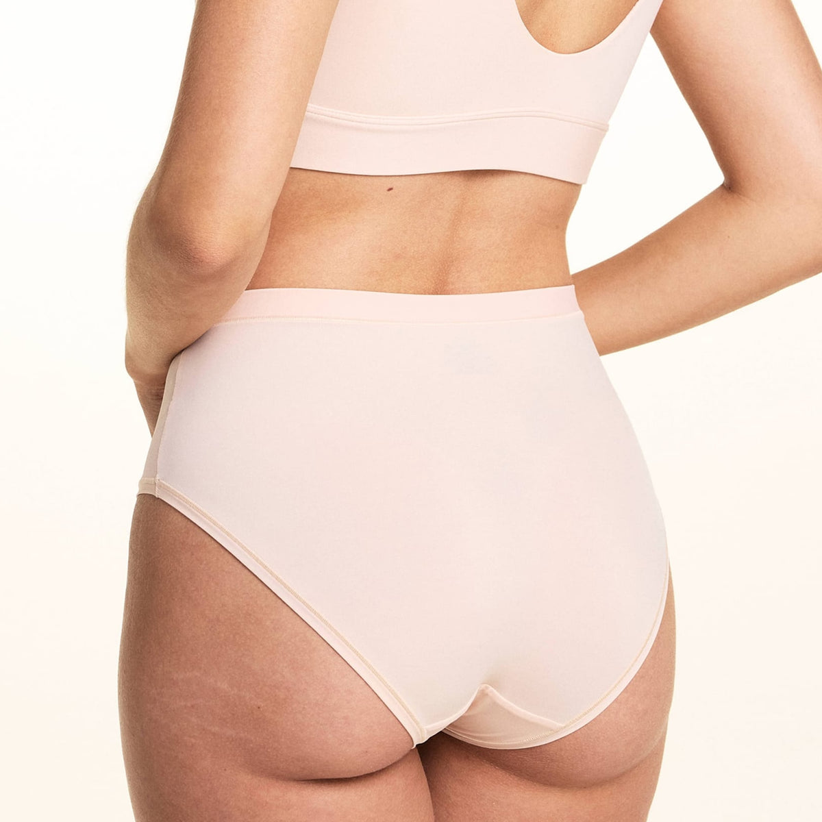 Close-up back view of Bliss Highwaist Brief in Rose showing high waistband and full coverage, paired with Bliss Bralette in Rose