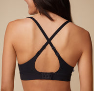Close up of Anna wearing the Bliss Plunge Adjustable Bralette and Bliss Bikini, showing the bralette’s back in a racerback configuration.