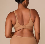 Back view of the bralette showing adjustable straps and classic hook-and-eye closure.