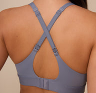 Close-up of the Bliss Plunge Adjustable Bralette in Steel shown with crisscrossed straps. This back view highlights the versatile strap configuration for added support and a secure fit.