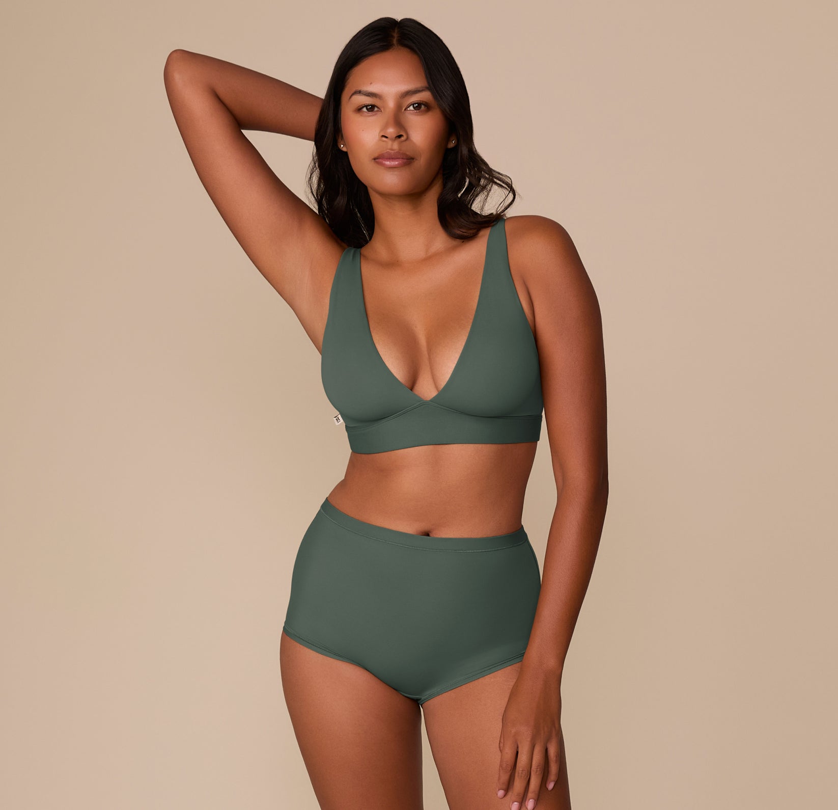 Victoria in the Bliss Boyshort in Fir, full-body shot styled with the matching Bliss Plunge Adjustable Bralette.
