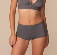 Alexis wearing the Bliss Boyshort in Smoke. The mid rise waistband and comfortable leg openings are emphasized. sizing: Alexis wears size Small