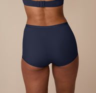 Back view of the Bliss Boyshort in True Blue on Nemesis, showing the smooth waistband and no-dig leg openings for maximum comfort.