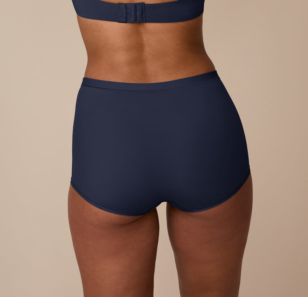 Back view of the Bliss Boyshort in True Blue on Nemesis, showing the smooth waistband and no-dig leg openings for maximum comfort.