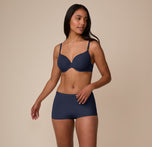 Front view of Nemesis wearing the Bliss Boyshort with the matching Base T-Shirt Bra in True Blue. The set emphasizes a coordinated, comfortable, everyday fit.