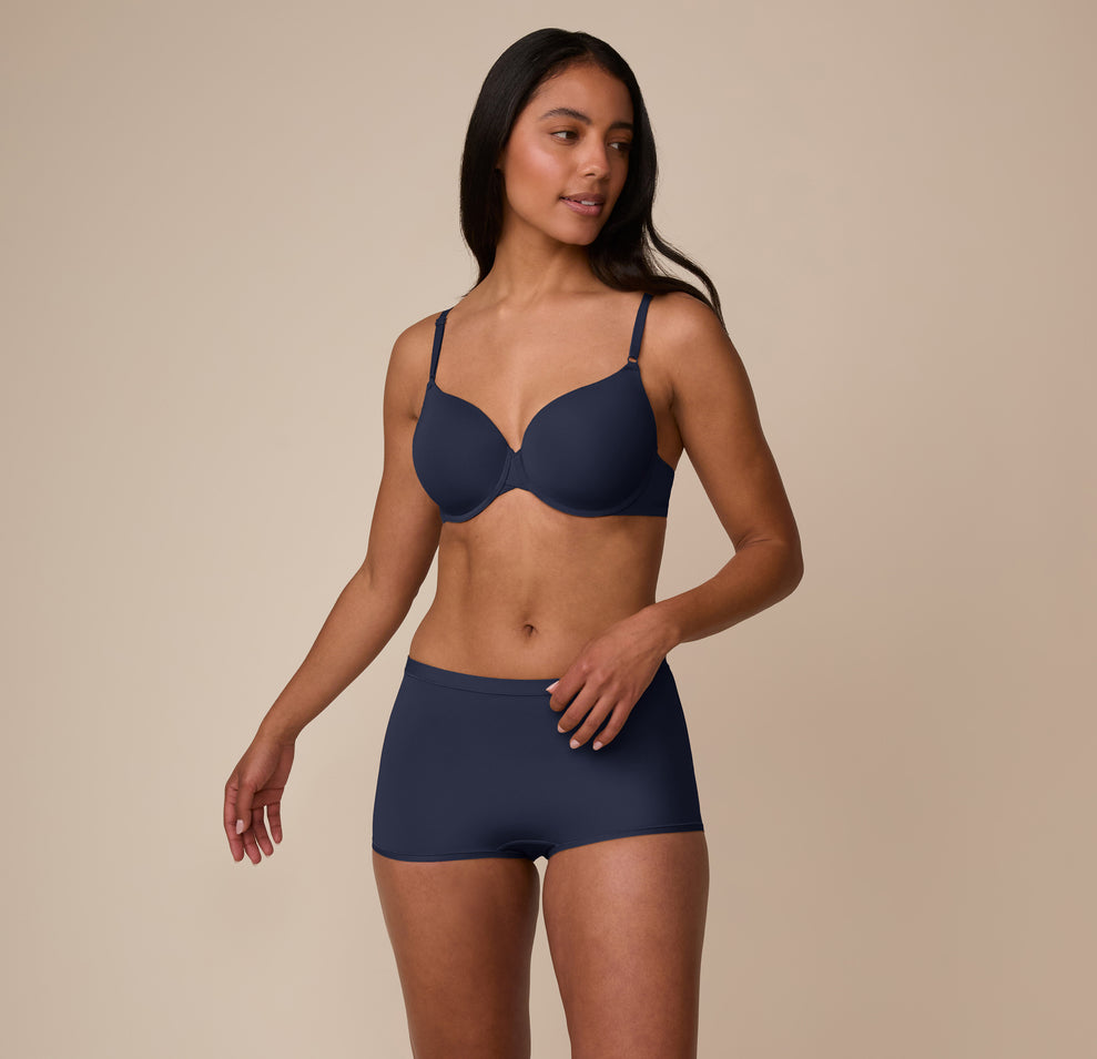 Front view of Nemesis wearing the Bliss Boyshort with the matching Base T-Shirt Bra in True Blue. The set emphasizes a coordinated, comfortable, everyday fit.