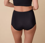 A rear view of Gracie showcasing the full-coverage back of the Bliss Boyshort in Black. The fabric sits flat against the skin for a comfortable, no-show fit.