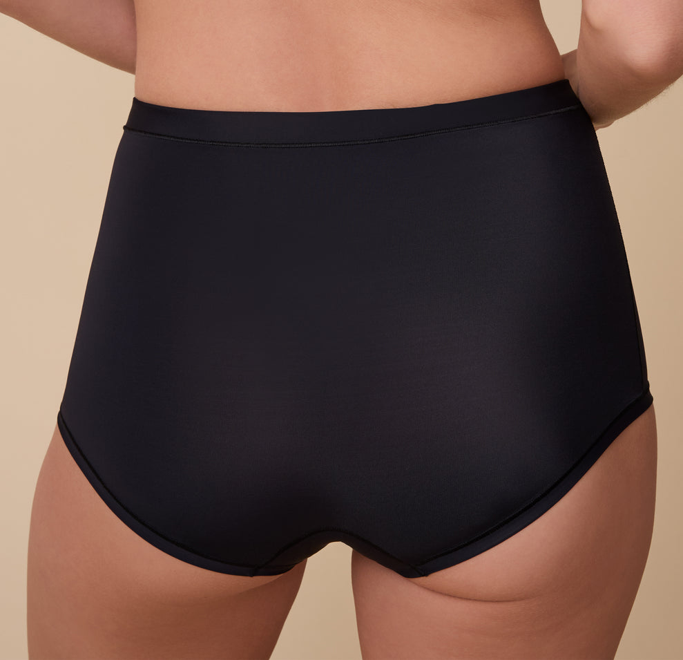 A zoomed-in shot of the waistband and leg openings, emphasizing the soft, stretchy fabric and smooth, clean edges.