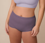 Sonnie is shown from the front wearing the Bliss Boyshort in Eclipse paired with the Bliss Bralette in Violet. The boyshort sits high on the waist with full coverage and a smooth, seamless finish, complementing the scoop-neck bralette above. sizing: Sonnie wears size Large