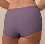Back close-up of the Bliss Boyshort in Eclipse worn by Sonnie. The image highlights the full-coverage design, clean stitching, and soft stretch fabric in the muted Eclipse tone.