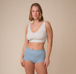 Full-body view of Sonnie wearing the Bliss Boyshort in Glacier, paired with the Bliss Bralette. She stands facing forward, emphasizing the flattering mid-rise cut and everyday comfort of the design.