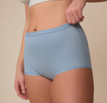 Close-up of Sonnie in the Bliss Boyshort in Glacier. The image highlights the clean stitching, minimal seam waistband, and ultra-smooth fabric.