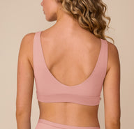 Back view of Freya in the Bliss Bralette in Dusty Rose, highlighting the low scoop back and wide supportive band.
