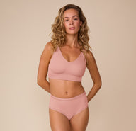 Full body shot of Freya wearing the Bliss Bralette and matching Bliss Highwaist Brief in Dusty Rose. The set emphasizes the ultra-soft, elastic-free comfort and smoothing fit.