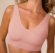 Close-up of Freya in the Bliss Bralette in Dusty Rose, focusing on the deep V-neckline and smoothing microfiber fabric.