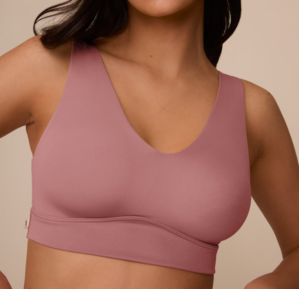 Close-up of the Bliss Bralette in Plum on Marcela, focusing on the bralette’s buttery-soft microfiber fabric and smooth finish under the bust.