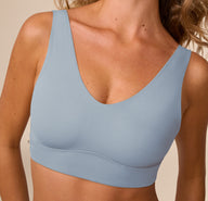 Close-up of Freya in the Bliss Bralette in Glacier. The image focuses on the soft, stretchy neckline and wide shoulder straps for a ultra-comfortable finish.