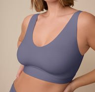 Close-up of Sonnie in the Bliss Bralette in Steel. The image highlights the subtle shaping, wide straps, and smooth underband.